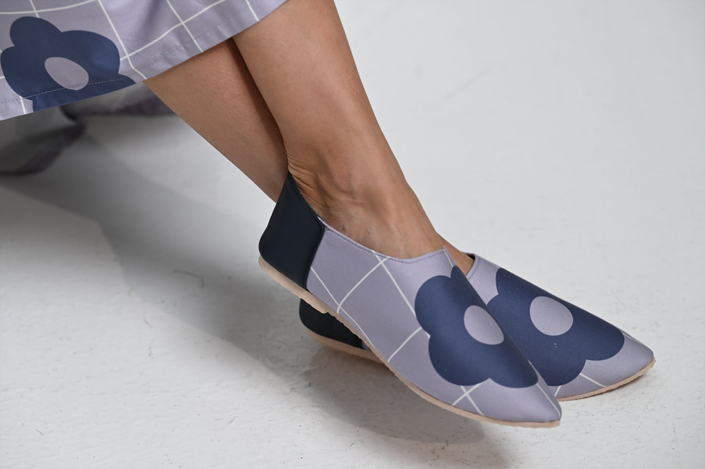 Blue shoes with a navy rose print