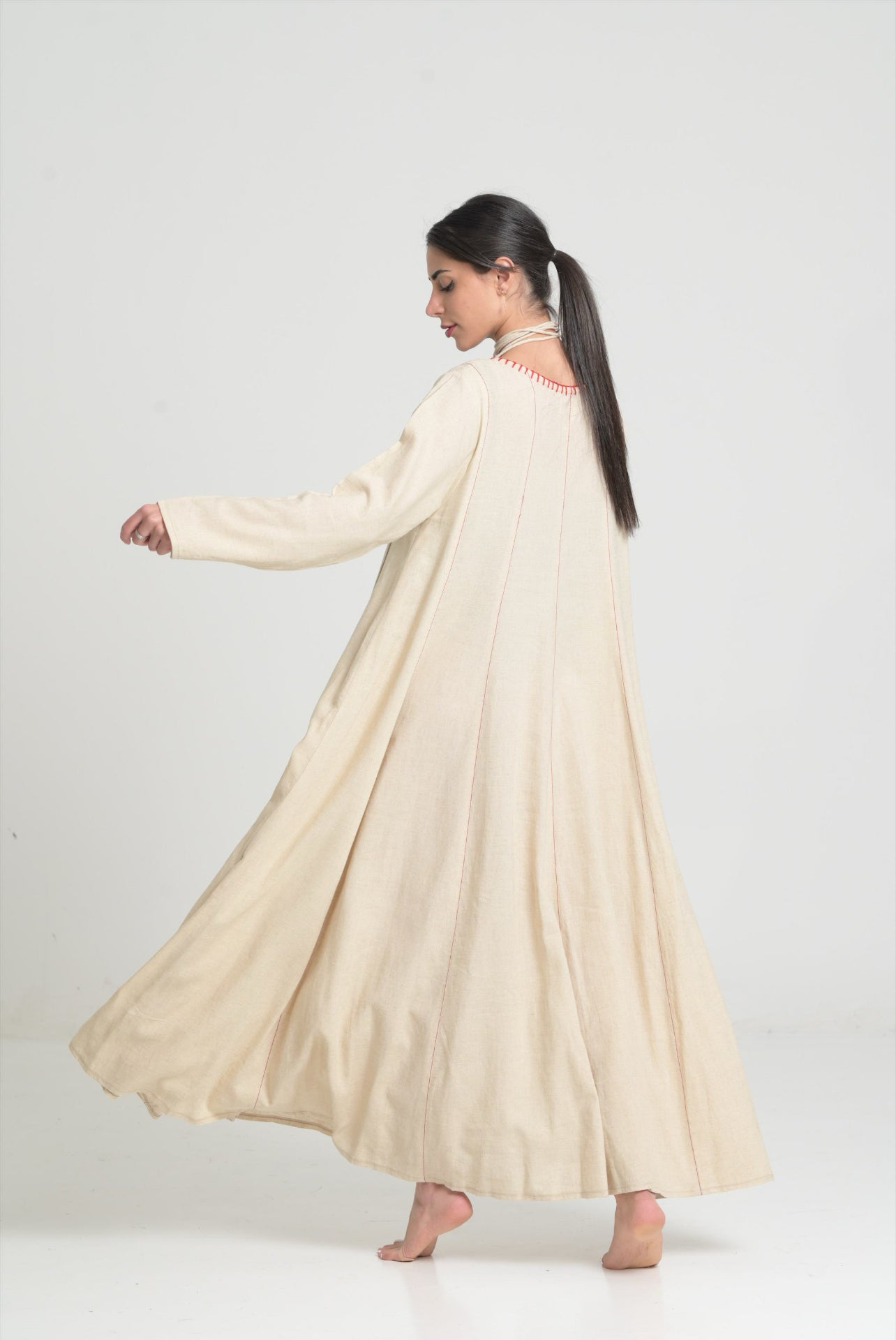 Beige dress with red stitching
