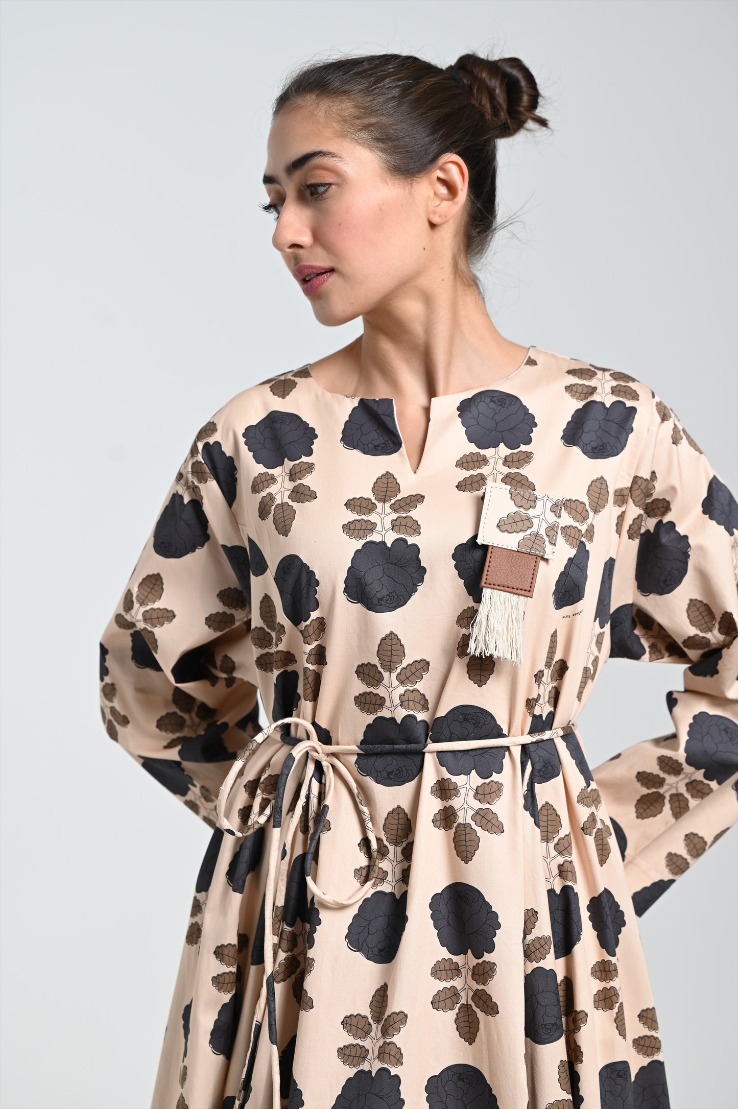 Beige dress & leather brooch