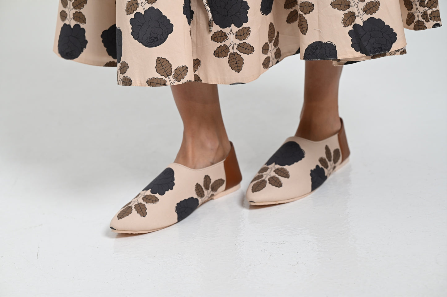 Beige shoes with black flowers