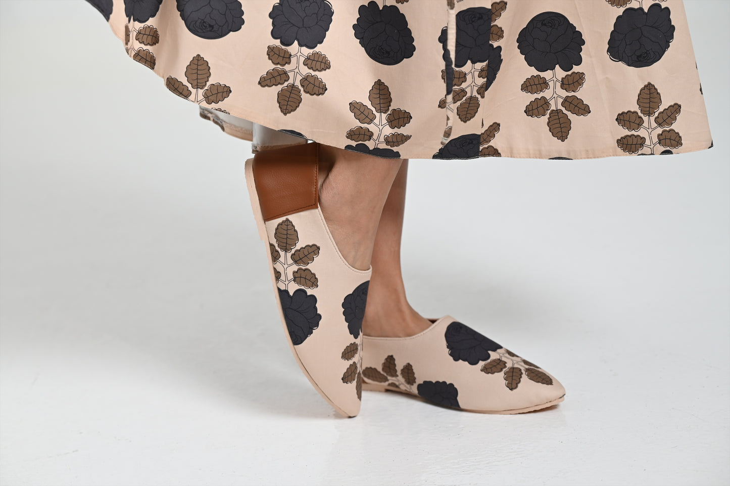 Beige shoes with black flowers